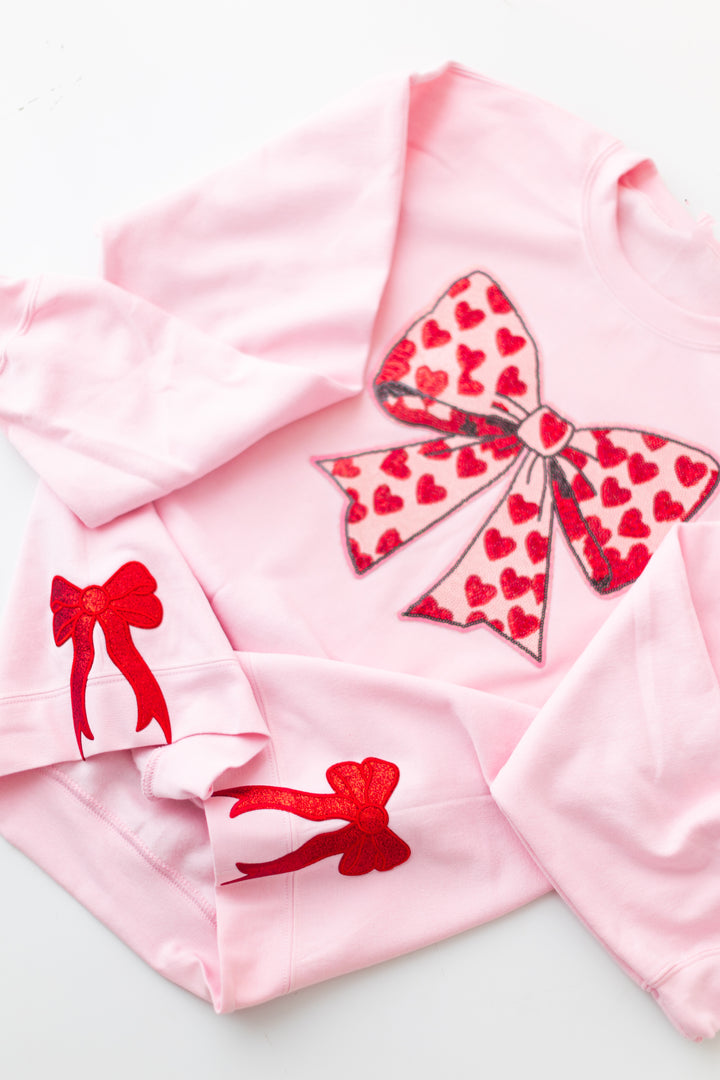 Pink Sequin Heart Bow Pullover with side bows